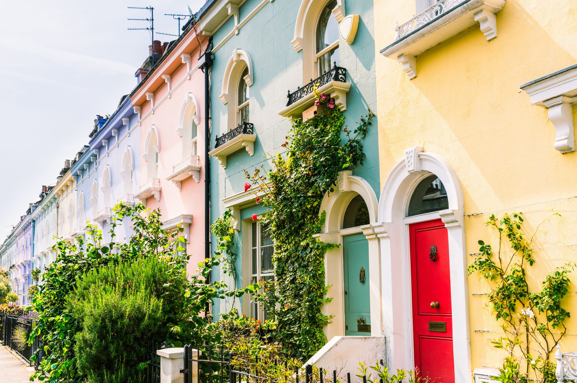 Pastel coloured terraced houses in summer
